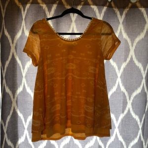 A very cute sunset yellow shirt for Spring!